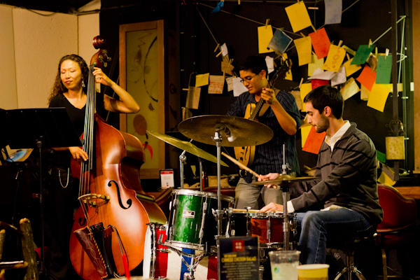 A trio featuring an upright bass player, jazz guitarist and drummer performed at the CoHo during a weekly Jazz Jam Monday night. Each week, musicians and spectators gather to perform, improvise and enjoy the music of others (ROGER CHEN/The Stanford Daily)