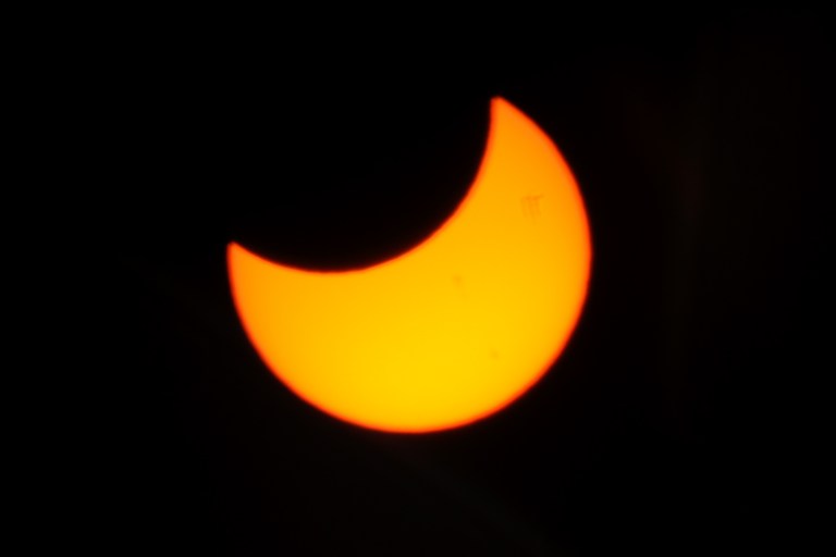 moon partially covering the sun