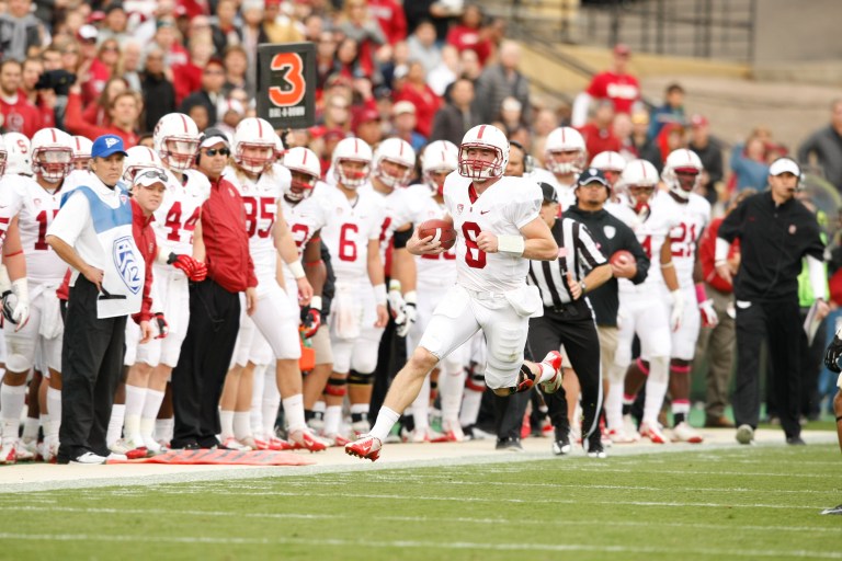 Redshirt freshman Kevin Hogan (8) has been impressive of late for Stanford, but his counterpart Marcus Mariota is drawing Heisman attention and the Ducks are a heavy favorite to ride his right arm to a win (Courtesy of Stanford Athletics/Stanfordphoto.com).