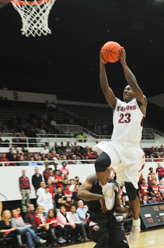 Gabriel Harris goes up for a dunk in Stanford's 68-57 win against Seattle on Wednesday night. (LEIGH KINNEY/The Stanford Daily)