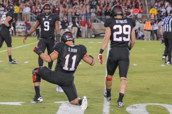 After helping Stanford win the Rose Bowl, Shayne Skov (11) will return to school with several other key fifth-year seniors for their final years of eligibility. (SIMON WARBY/The Stanford Daily)