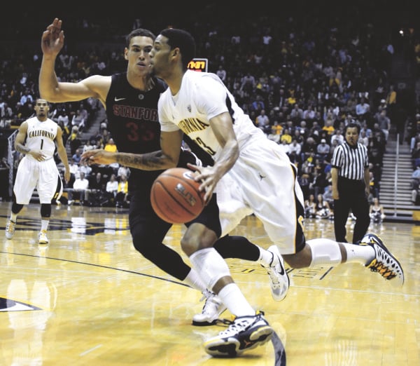 Stanford's Dwight Powell defends a drive by California's Allen Crabbe during the first half at Haas Pavilion on Wednesday night. Powell and Crabbe were at the center of a second-half brawl that saw coaches and players from both teams ejected, but Stanford survived the spike in energy and maintained its double-digit lead, eventually winning 83-70. (Susan Tripp Pollard/Contra Costa Times/MCT)