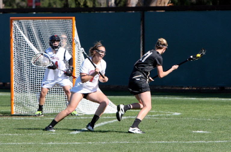 Senior defender Elizabeth Adam (middle) was named to the all-tournament team as Stanford captured the MPSF title. (ALISA ROYER/The Stanford Daily)