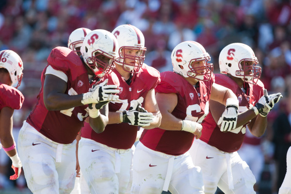 Despite the graduation of center Sam Schwartzstein (second from right), the return of seniors Cameron Fleming (left), Kevin Danser (second from left) and preseason All-American David Yankey (right) sets the Cardinal up for 2013 with one of the best offensive lines in school history. (David Elkinson/isiphotos.com)