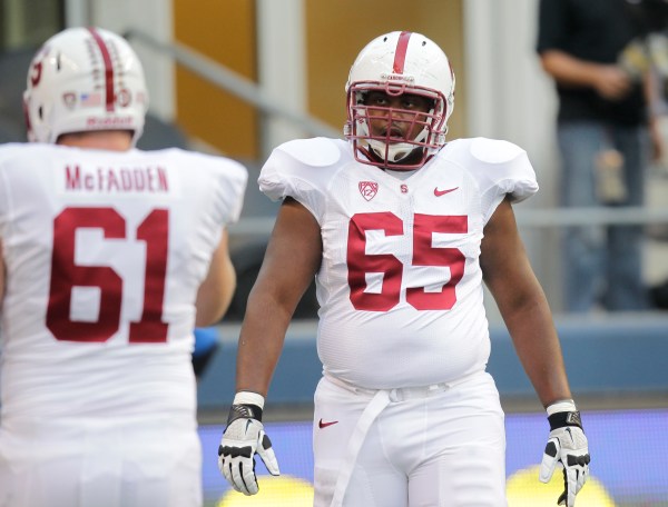 Fifth-year senior Khalil Wilkes (right) beat out senior Conor McFadden (left) for the starting center job, one of five position battles finalized by head coach David Shaw on Thursday. (STEPHEN BRASHEAR/isiphotos.com)