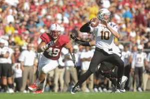 Fifth-year senior defensive end Ben Gardner (left) is nursing an arm injury that his head coach says "hurts like a son of a gun," but given the Cardinal's thinned defensive line, he'll have to make an impact this Saturday regardless. (SIMON WARBY/The Stanford Daily)