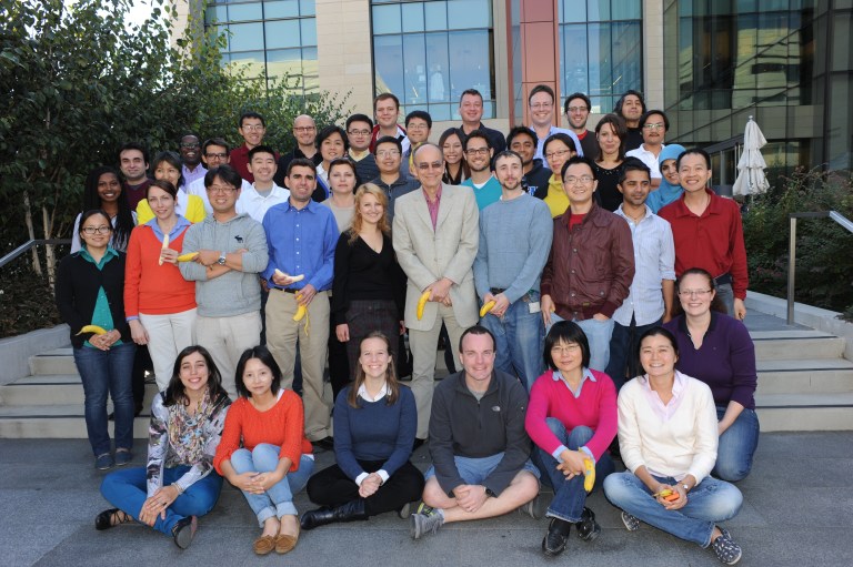 After Thomas Sudhof (center, tan suit) won the 2013 Nobel Prize, three labs came together to celebrate. Faculty credit Stanford's collaborative atmosphere for supporting cutting-edge research. (Courtesy of Lulu Chen)