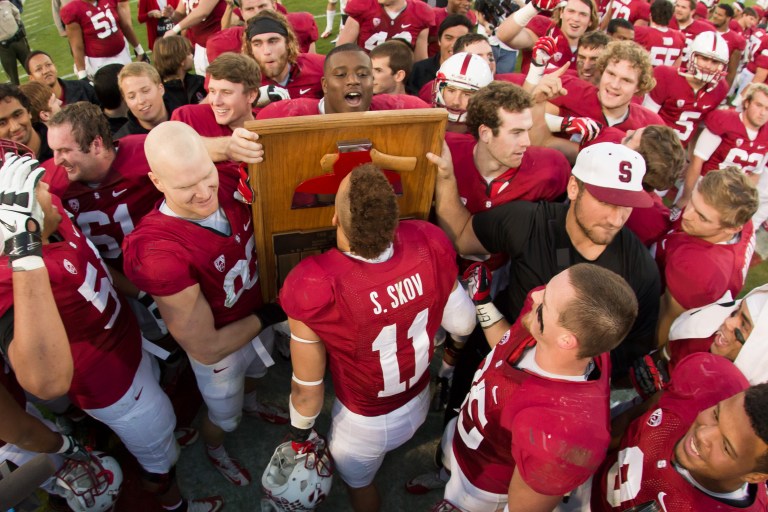 Shayne Skov (center) is clearly happy to have the Axe for a fourth straight year. What are The Daily's football writers thankful for this holiday season? (BOB DREBIN/StanfordPhoto.com)