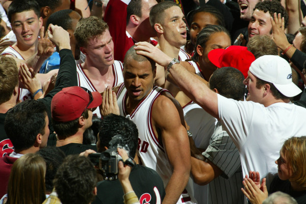 Rob Little (center), Matt Lottich (middle left) and Nick Robinson (middle right) make their way to the crowd after Robinson's buzzer-beater. (DAVID GONZALES/Stanford Athletics)