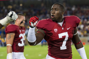 Junior Aziz Shittu (right) has finally shown the coaching staff what it's been looking for, and should be a major part of Stanford's defensive line in 2014. (JIM SHORIN/StanfordPhoto.com)