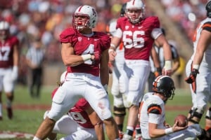 Senior inside linebacker Blake Martinez (left) became very acquainted with Sean Mannion (right, on ground) after the former sacked the latter 2.5 times throughout the course of the game.