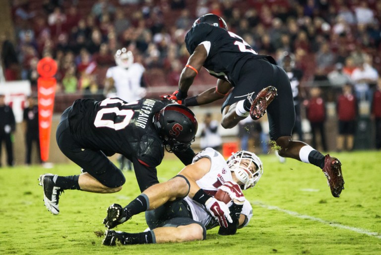 Junior defensive back Zach Hoffpauir (left) had a monster game as the anchor of the Stanford secondary, setting a record among active Cardinal players with 15 tackles. In addition, he played solid coverage as the Cardinal's primary nickelback and broke up two passes. (ROGER CHEN/The Stanford Daily)