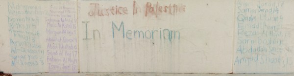 Members of Stanford Students for Justice in Palestine wrote the names of some of the children killed in the recent Israel-Palestine conflict on the steps of the stage in White Plaza (Eric Thong/STANFORD DAILY)