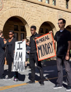 Monday afternoon, student protesters surrounded the Circle of Death and urged bikers to "slow down for Michael Brown." (KRISTEN STIPANOV/The Stanford Daily)