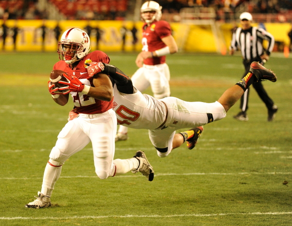 Senior running back Remound Wright (left) scored three touchdowns today to record his third consecutive multi-score performance. (MIKE KHEIR/The Stanford Daily)