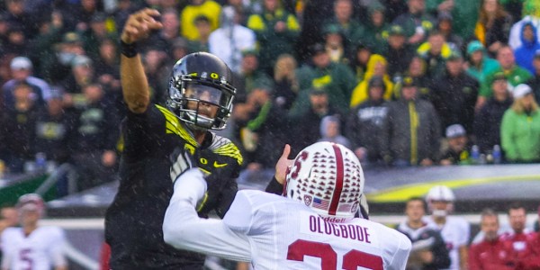 Heisman Trophy winner Marcus Mariota (left) and the Oregon Ducks may have lost the national title game to Ohio State, but they have been the face of the Pac-12's continued rise this season. (SAM GIRVIN/The Stanford Daily)