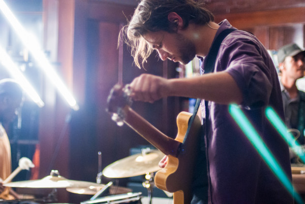 Frontman Jake Berry tuning his guitar in preparation for another stirring song. Photo by Gabriela Groth.