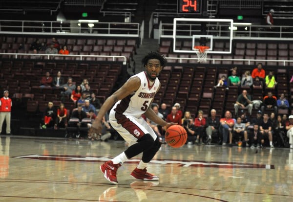 Senior Chasson Randle (right) is now Stanford's all-time leading scorer with 2,350 career points. He scored a game-high 24 points in the Cardinal's NIT semifinal win on Tuesday night. (RAHIM ULLAH/The Stanford Daily)