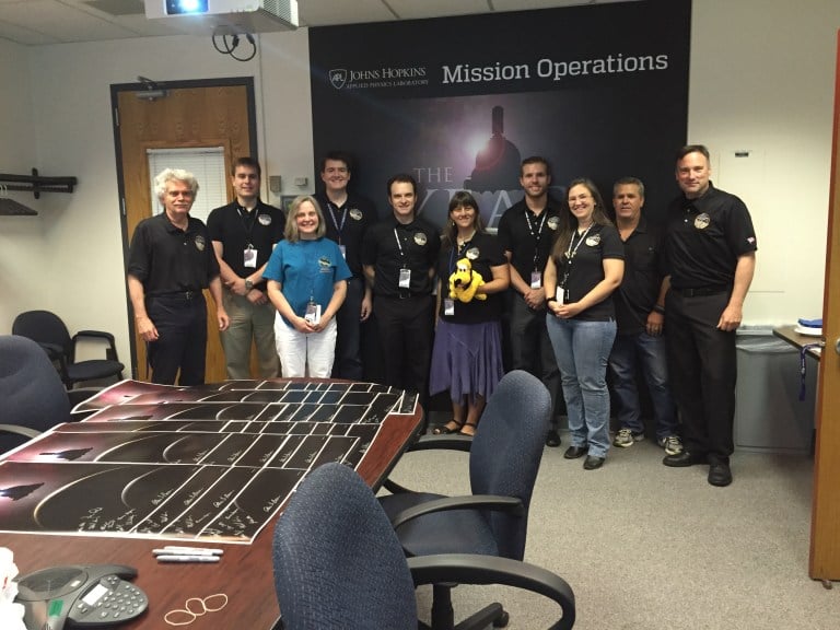 Ivan Linscott (left) and New Horizons Mission Operations team gathered at NASA's Mission Operations Center on the evening that the spacecraft passed Pluto.
(Courtesy of Ivan Linscott)