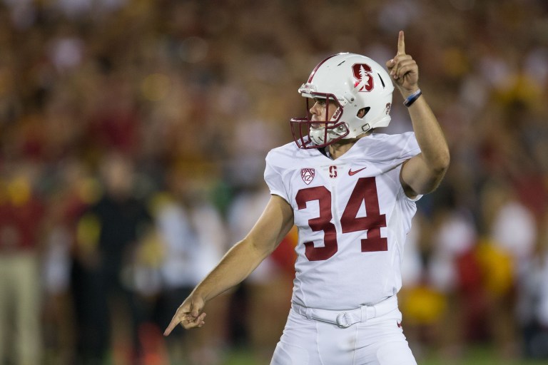 Senior kicker Conrad Ukropina (above) kicked a 46 yard field goal with 2:27 left in the Cardinal's game against USC to put Stanford up by 10 and secure the win. The kick finally earned him redemption after he missed a 30 yard field goal that would prove to be the difference in the matchup between the two teams at Coliseum in 2013. (DON FERIA/isiphotos.com)