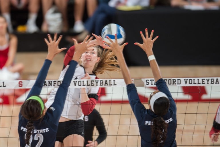 Merete Lutz (center) returned to the court after missing the first two games of the season with a finger injury. She recorded a career-high 19 kills to help lead Stanford to a 3-1 victory over Illinois. (DAVID BERNAL/isiphotos.com)