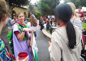 A staff member from the Office of Sustainability talks with students after they disposed of their lunch waste in the compost bins. Staffers dressed up in costumes and held signs to raise awareness about composting.