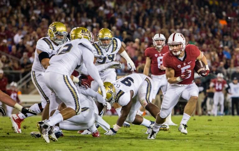 Sophomore running back Christian McCaffrey (right) set the new Stanford record for rushing yards in a single game with his 243 yards on 25 carries, beating out the previous record of 223 set by Toby Gerhart in 2009 in a game against Oregon. (SAM GIRVIN/The Stanford Daily)