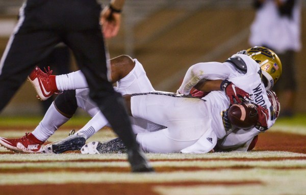 Junior Francis Owusu (back) makes a third-quarter touchdown catch on the back of UCLA safety Jaleel Wadood in the third quarter of Stanford's 56-35 rout over No. 18 UCLA. The catch, which came off of a reverse pass from the Wildcat, trended nationally on Twitter and has drawn comparisons to Odell Beckham, Jr.'s once-in-a-generation catch from last season. (SAM GIRVIN/The Stanford Daily)