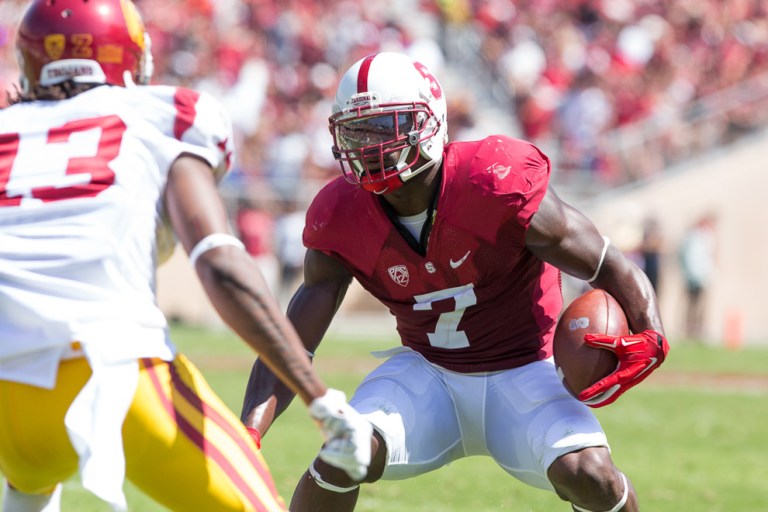 In the Cardinal's 2013 matchup against Washington, Ty Montgomery '15 (above) had a 99-yard return on the opening-kickoff, along with a 39-yard touchdown before the end of the half. The Cardinal went on to win in a 31-28 nail-biter. (TRI NGUYEN/The Stanford Daily)