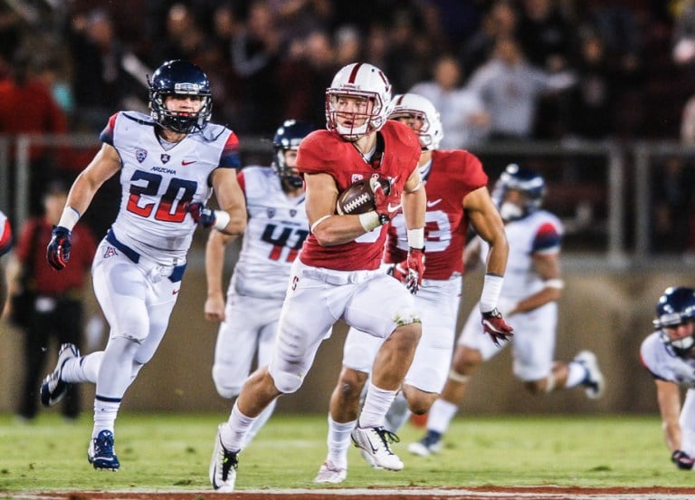 Sophomore running back Christian McCaffrey (center) scored the first rushing touchdown of his career as part of a 156-yard rushing performance against Arizona, his third consecutive game of over 100 yards rushing. Remound Wright added three touchdowns and Barry Sanders also found the end zone as Stanford rolled, 55-17. (SAM GIRVIN/The Stanford Daily)