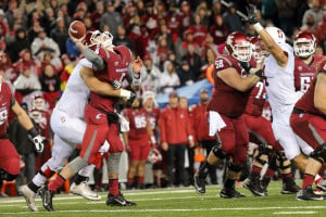 Fifth-year senior defensive end Brennan Scarlett (left) sacks Washington State quarterback Luke Falk. Although Stanford entered the game 11th in the Pac-12 in sacks, the Cardinal tied a season-high with 3 sacks of Falk on a cold Halloween night in Pullman. (BOB DREBIN/isiphotos.com)