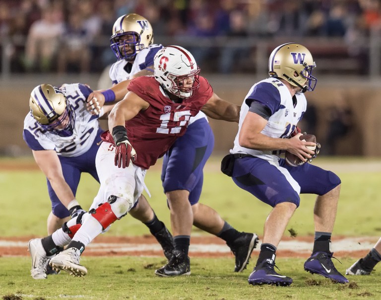 FIfth-year senior defensive lineman Brennan Scarlett (center), a graduate transfer from Cal, is having a career year at Stanford, recording  5.5 tackles for loss and 3.5 sacks. (DAVID BERNAL/stanfordphoto.com)