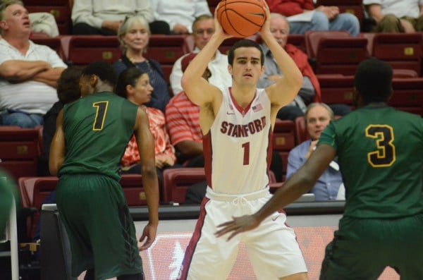 Senior guard Christian Sanders (center) had a career-best game against Wisconsin-Green Bay, notching 23 points and 6 rebounds. Sanders, a shooting guard, played at the point guard position for the first time due to Robert Cartwright's season-ending injury (LAUREN DYER/The Stanford Daily).