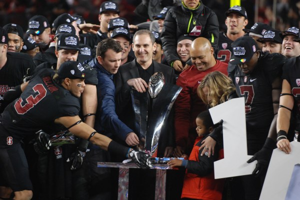 Stanford celebrates as it accepts the Pac-12 Championship trophy. The championship marked the Cardinal's third in four seasons. (RAHIM ULLAH/The Stanford Daily)