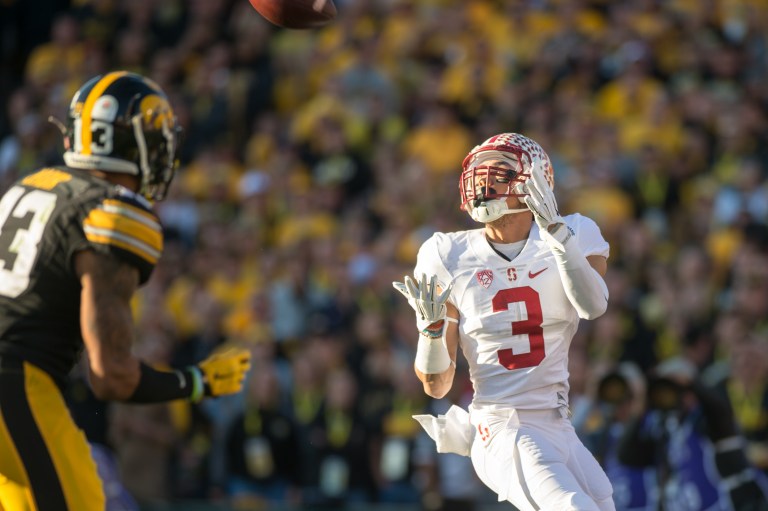 Senior wide receiver Michael Rector (right) catches his first touchdown pass of the 102nd Rose Bowl on a fake fumble play called "Hawkeye" to stretch the lead to 35-0. He would later add a fourth-quarter touchdown for the first multi-score game of his career. Rector announced on Saturday that he will return to Stanford for the 2016 season, using his fifth and final year of eligibility. (RAHIM ULLAH/The Stanford Daily)