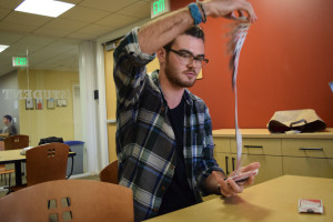 Drew Lexmond '17 performs a magic trick. (