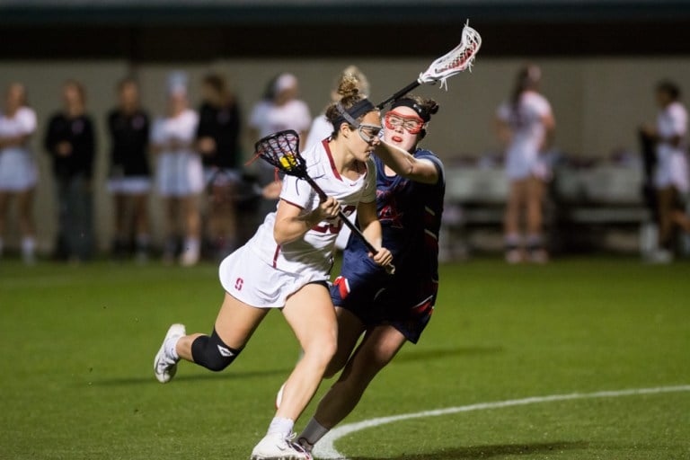 Sophomore Sandy Smith (left) scored a career-best 3 goals and notched an assist on Tuesday night. The Cardinal routed the St. Mary's Gaels 20-1 in their home opener. (RAHIM ULLAH/The Stanford Daily)