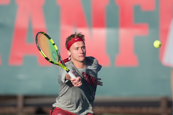 Senior Maciek Romanowicz (above) was electric for Stanford on Friday afternoon, helping to clinch the doubles point and winning his singles match on Court 5 in a third-set tiebreak. Despite his best efforts, the Cardinal fell to USC, 5-2. (RAHIM ULLAH/The Stanford Daily)