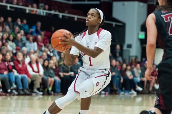 Junior guard Lili Thompson (above) scored 13 of the Cardinal's 26 points in the first half, but her efforts, as well as a hot shooting night from Karlie Samuelson, weren't enough as the Huskies jumped out to a 12-0 lead early and never trailed to claim their first ever Final Four berth. (RAHIM ULLAH/The Stanford Daily)