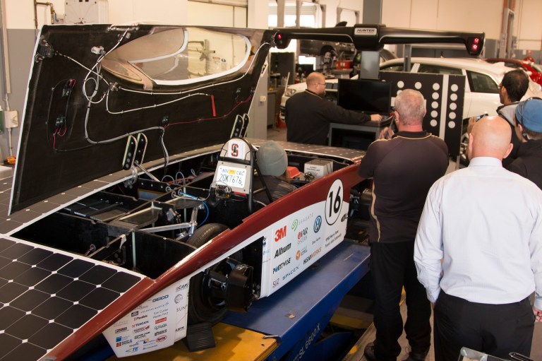 Stanford Solar Car assembles last year's vehicle. The group's continued activity is threatened by difficulties finding a sponsor (Courtesy of Solar Car)