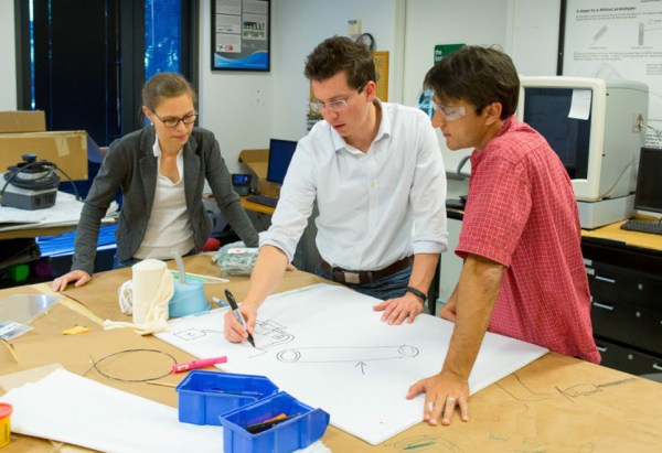 Veronique Peiffer and Richard Timm work with lecturer Ross Venook on ideas for solutions to unmet health-care needs (Norbert von der Groeben/STANFORD NEWS SERVICE).