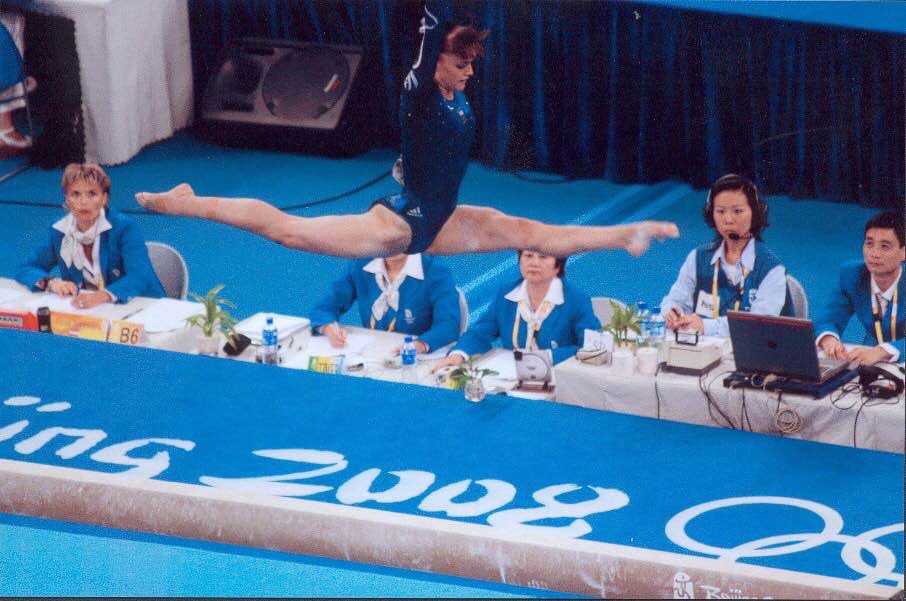 Rebecca Wing '15 competes on the bars for the GBR at the 2008 Beijing Olympic Games. 