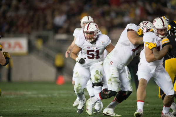 Guard Joshua Garnett (left) won the Outland Trophy last season, awarded to the nation's best interior lineman, before being selected in the first round of the NFL Draft by the San Francisco 49ers. (RAHIM ULLAH/The Stanford Daily)