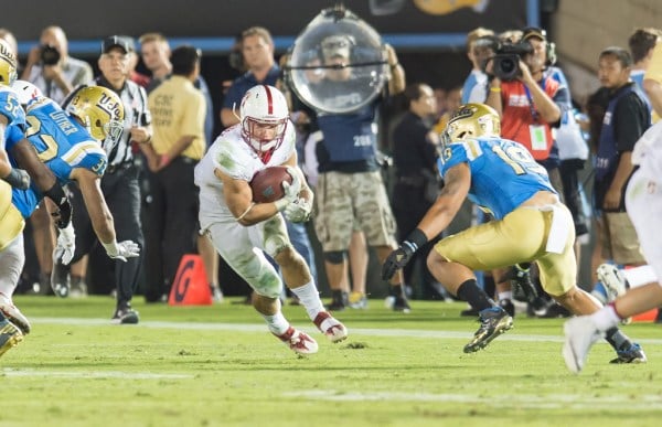 Junior running back Christian McCaffrey evades the UCLA defense on Saturday. A key for Washington will be to contain the Heisman contender. (DAVID BERNAL/isiphotos.com)