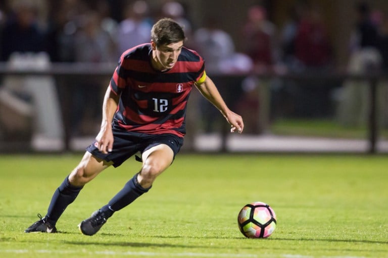 Drew Skundrich looks to move the ball up the field during Stanford's win against Harvard. Men's soccer will look to score first against Cal this week. (AL CHANG/isiphotos.com)