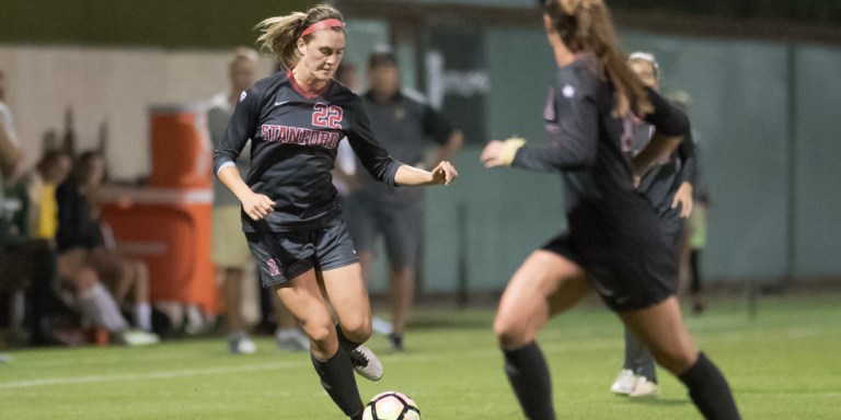 Sophomore forward Averie Collins makes a move past a defender, allowing her to get the ball to a fellow Cardinal player. The Stanford attacking end has been paramount in an almost undefeated season. (LYNDSAY RADNEDGE/isiphotos.com)