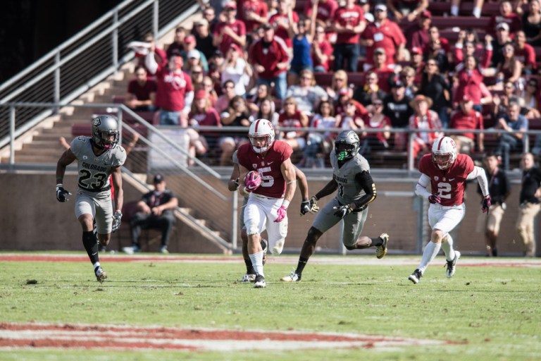 Christian McCaffrey carries the ball in space as he runs down the field in search of a touchdown. McCaffrey will be an essential piece as Stanford takes on Oregon. (RYAN JAE/The Stanford Daily)