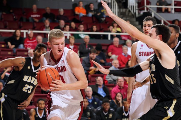 Junior Michael Humphrey (left) topped the Cardinal scoresheet against the Huskies, scoring 18 points and 10 rebounds. He scored eight points in the final 3:36 to stop Stanford from blowing a 43-24 halftime lead. (RAHIM ULLAH/The Stanford Daily)