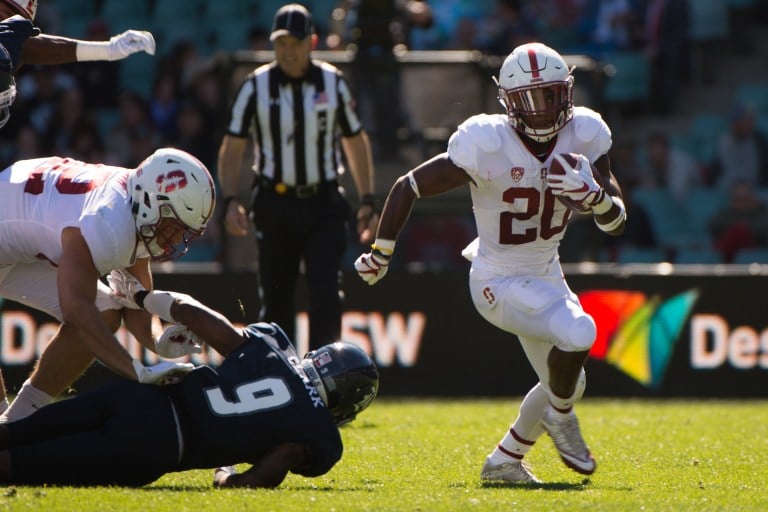 Junior running back Bryce Love (20, above) broke his first carry for 62 yards. He ended the game with 180 rushing yards on 13 carries.(DON FERIA/isiphotos.com)