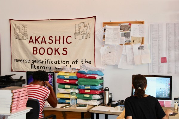 Ena Alvarado '18 (right) sits at her desk at Akashic Books (Courtesy of Miranda Shepherd).